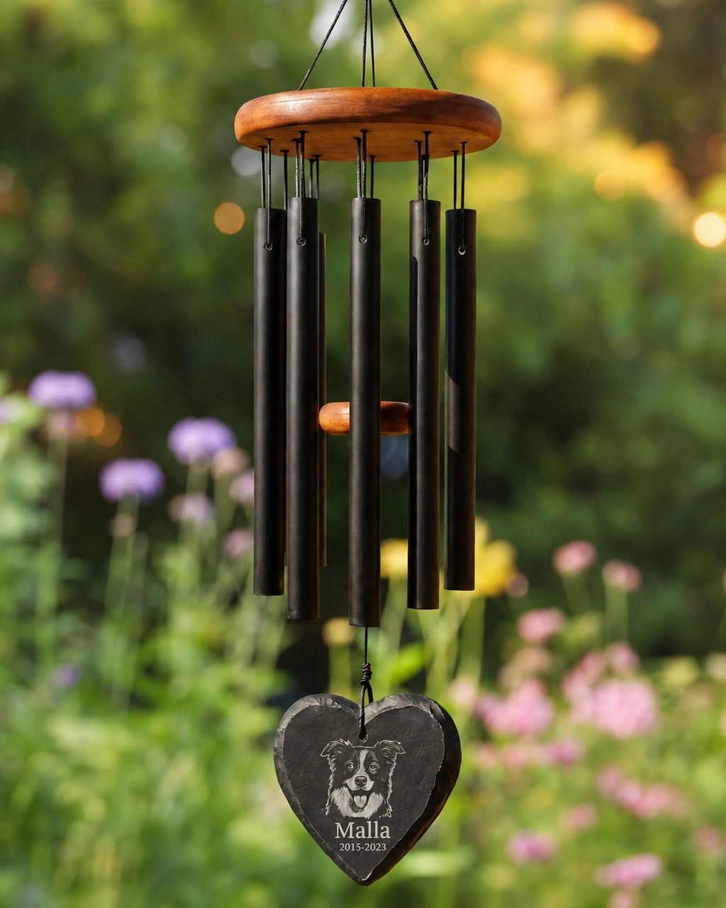 Memorial mockup 2026-10-22 — Malla memorial wind chime in a flower garden