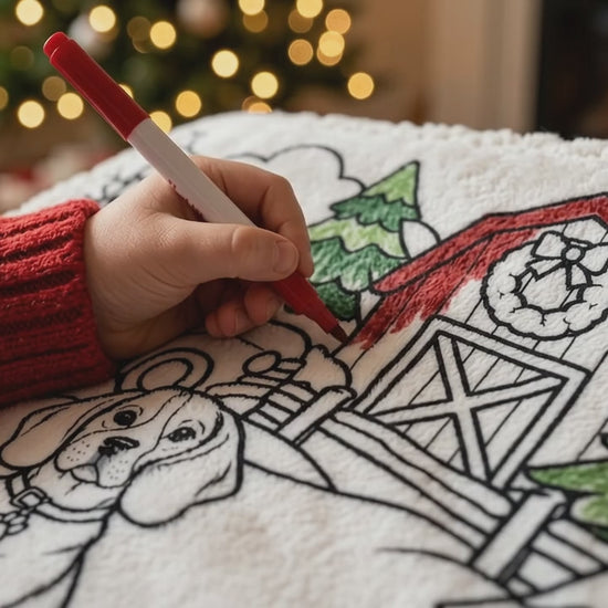 Hand coloring the barn roof on a personalized Christmas pet coloring blanket